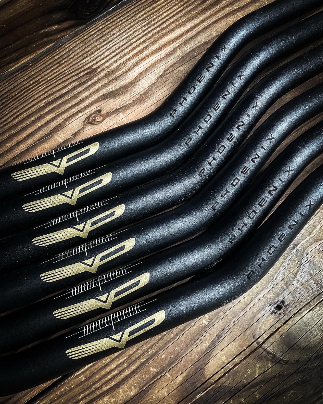 Black Phoenix Handlebars with gold Phoenix branding